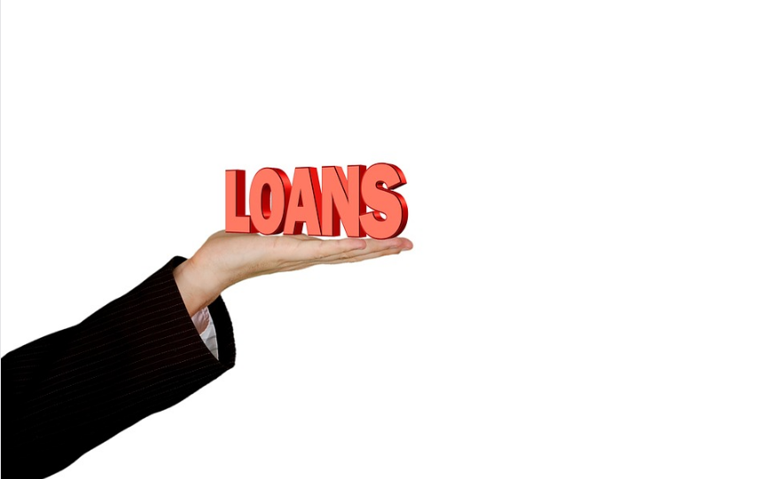 hand giving out a loan